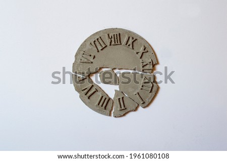 Reinforced concrete wall clock, broken wall clock, white background. Royalty-Free Stock Photo #1961080108