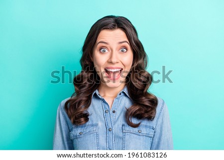 Photo of young excited girl amazed shocked surprised news sale isolated over turquoise color background