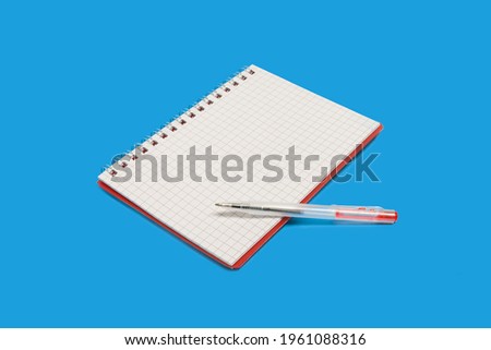 spiral notebook with a pen on a blue background Royalty-Free Stock Photo #1961088316