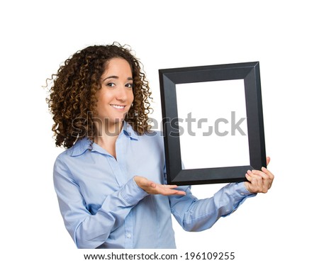 Closeup portrait happy, smiling business woman holding, presenting black photo frame with space for ad, isolated white background. Positive human emotions, facial expression, life perception, attitude
