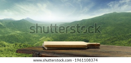 Table background of free space and spring landscape of mountains. 