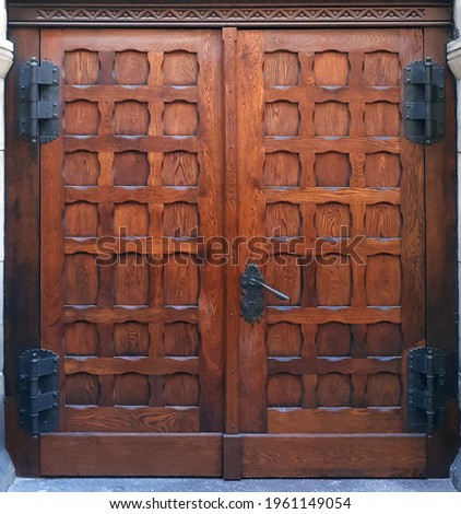Antique wooden door in a 13th century Gothic church