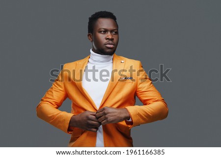 Black guy dressed in fashion clothing Royalty-Free Stock Photo #1961166385