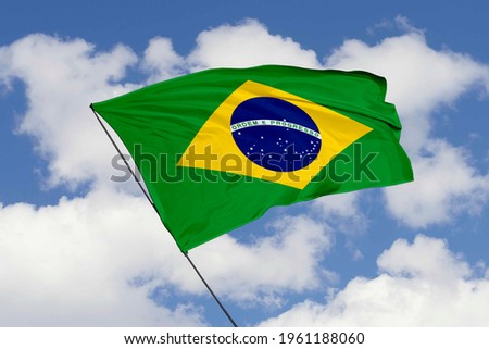 Brazil flag isolated on sky background with clipping path. close up waving flag of Brazil. flag symbols of Brazil.