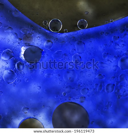 Abstract, colorful composition with oil, water and ink 