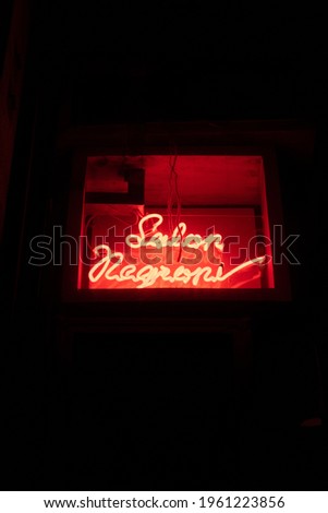 Neon signs of different text