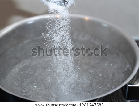 Salt in hot bowl water in pan