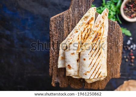 shawarma doner kebab sandwich burrito meat vegetable auce tacos meal lunch portion menu food Takeaway snack trend meal copy space food background rustic. top view