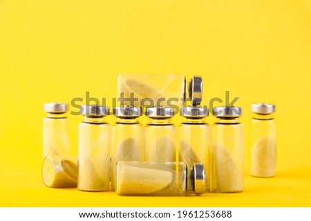 Bubbles, ampoules with dry probiotic, bifidobacteria, with probiotic powder inside on a yellow background. Copy space.