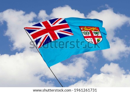 Fiji flag isolated on sky background with clipping path. close up waving flag of Fiji. flag symbols of Fiji.