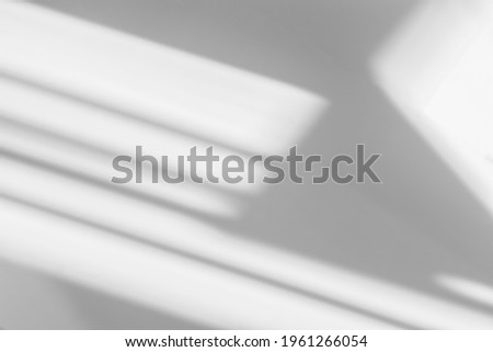 Abstract shadow and striped diagonal light blur background on white wall  from window,  architecture dark gray and sunshine diagonal geometric effect overlay for backdrop and mockup design
