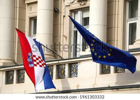 Flags of Croatia and European Union on Croatian Parliament building in Zagreb.