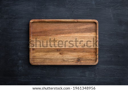 Mango tree wooden kitchen board. Perfect place to cut meat. Place for the dish. Beautiful painted dark navy blue background.
Food advertising. Pictures of dishes in the restaurant. Wooden serving tray