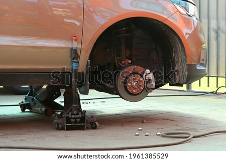 Maintenance of the brake system in the car, the car on the jack