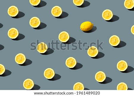 Yellow background. Lemon fruit on gray background.