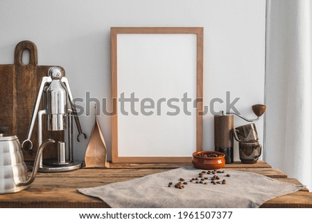 Home barista brewing set with manual grinder, dripper, design drip kettle and empty Photo frame mock up.