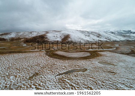 Aerial photography of the natural scenery of the wetland after the snow