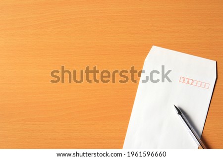 A envelope and a pen.