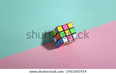 Odessa, Ukraine - December 29, 2020: Rubik's cube on blue pink pastel background Royalty-Free Stock Photo #1961605954