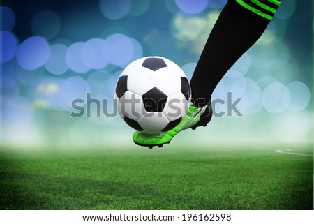 Football or soccer ball at the kickoff of a game - outdoors