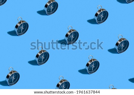 Pattern of compass. Trendy background of compass on a blue background. Colorful pattern. View from above