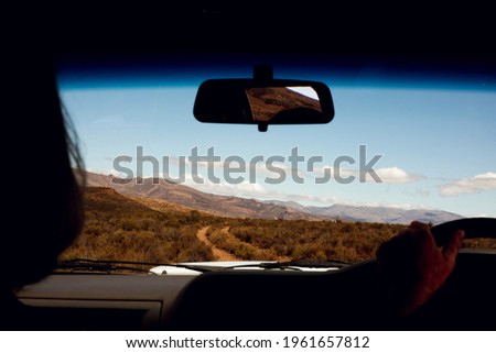 Silhouette's picture of driving in the car on a farm with a beautiful sky.