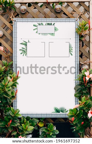 Blank signboard on a beautiful decorative wooden fence