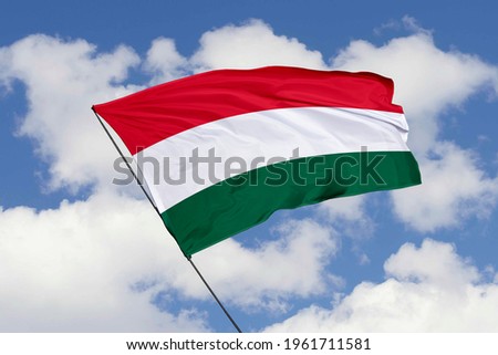 Hungary flag isolated on sky background with clipping path. close up waving flag of Hungary. flag symbols of Hungary.