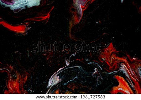 Texture in the style of fluid art. Abstract background with swirling paint effect. Liquid acrylic paint background. Black, yellow, white, lilac and red colors.