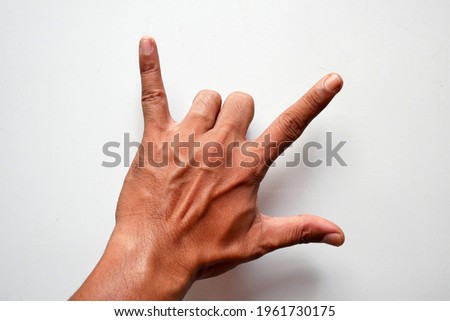 Hand with 3 fingers metal music symbol