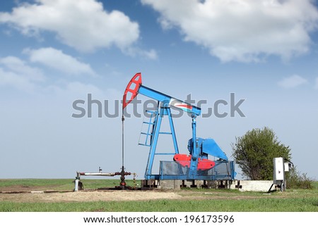 oil pump jack on field