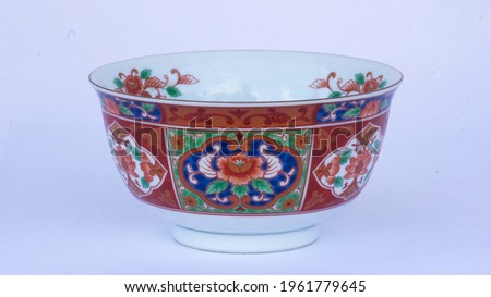 A vintage of small-colorful Chinese soup bowl with floral pattern,on white background,taken on side view,close up image.