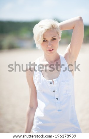 woman in white clothing on the beach