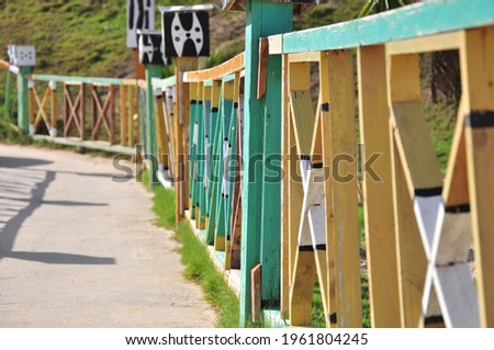A photo of a colorful wooden fence