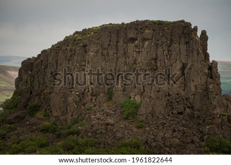 Pareidolia face in rock out cropping on basalt rock cliffs along the columbia river gorge near goldendale washington