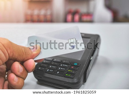 Close up of unrecognizable customer doing a contactless payment, Paying made simple