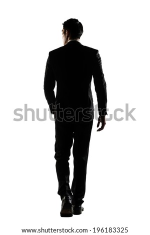 Silhouette of Asian business man walk with confidence, full length portrait isolated on white. Rear view. Royalty-Free Stock Photo #196183325