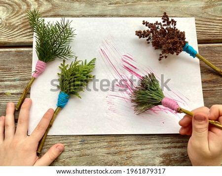 drawing with brushes made of natural material, for children. Kids craft.