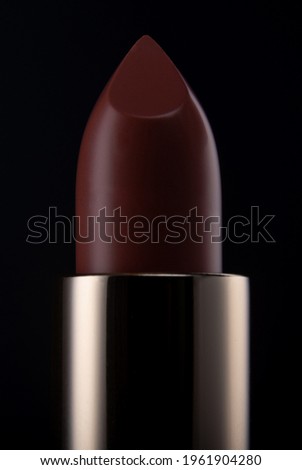 Closeup picture of a red lipstick tip