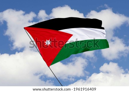 Jordan flag isolated on sky background with clipping path. close up waving flag of Jordan. flag symbols of Jordan.