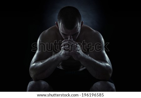 Close up of young sportsman focusing before the game isolated on black background Royalty-Free Stock Photo #196196585