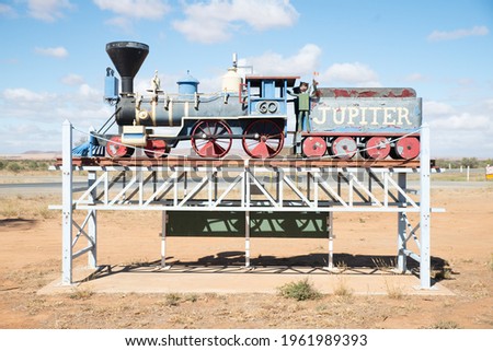 Terowie, Australia - Apr 20, 2021:  Terowie Welcome to town road sign with Jupiter 60 Steam Train next to road the roadhouse