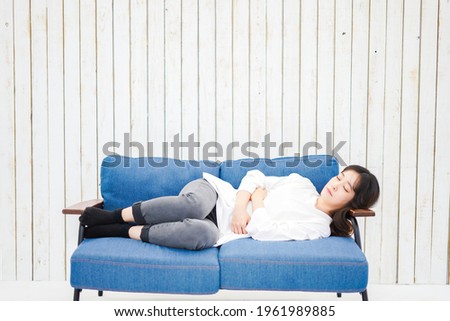 Young woman taking a nap in her room