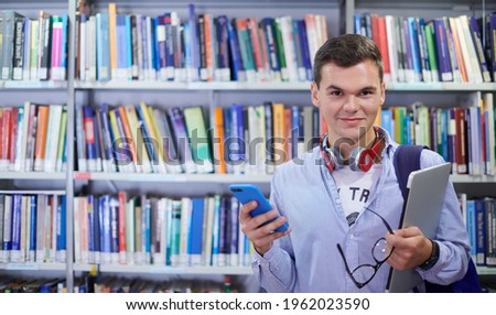 the student uses a notebook, latop and a school library