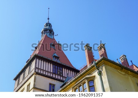 The roof of the castle, the top of the monument with a blue sky
