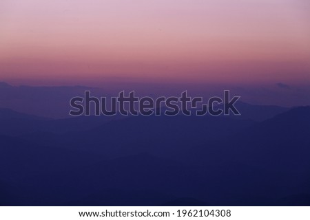 A scenery of texture of mountain and sky after sunset from Thailand. A colors sky with copy space at the top of the picture.
