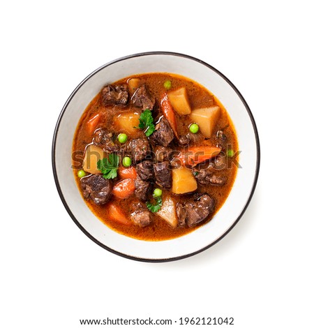 Irish stew made with beef, potatoes, carrots and herbs. Traditional St patrick's day dish. isolated on white background, top view.	 Royalty-Free Stock Photo #1962121042