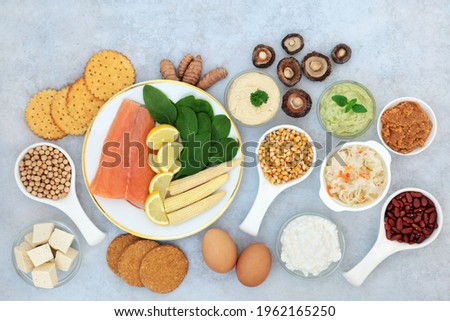Health food collection to combat bipolar disorder and manic depression with foods high in omega 3, protein, vitamins, selenium, magnesium, serotonin and tryptophan. Flat lay. Royalty-Free Stock Photo #1962165250