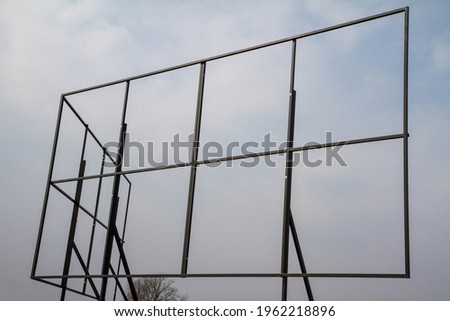 Empty billboard structure against the sky