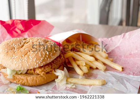 close up cheese with pork burger and french Fries fron table in fast food resturant, junk foods